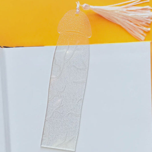 Decorative bookmark with tassel on a yellow and white background