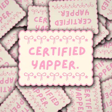 Pattern of 'Certified Yapper' stickers with decorative elements on a pink background.