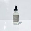 Room Spray Bottle of 'Coastal Storm' perfume on a white surface
