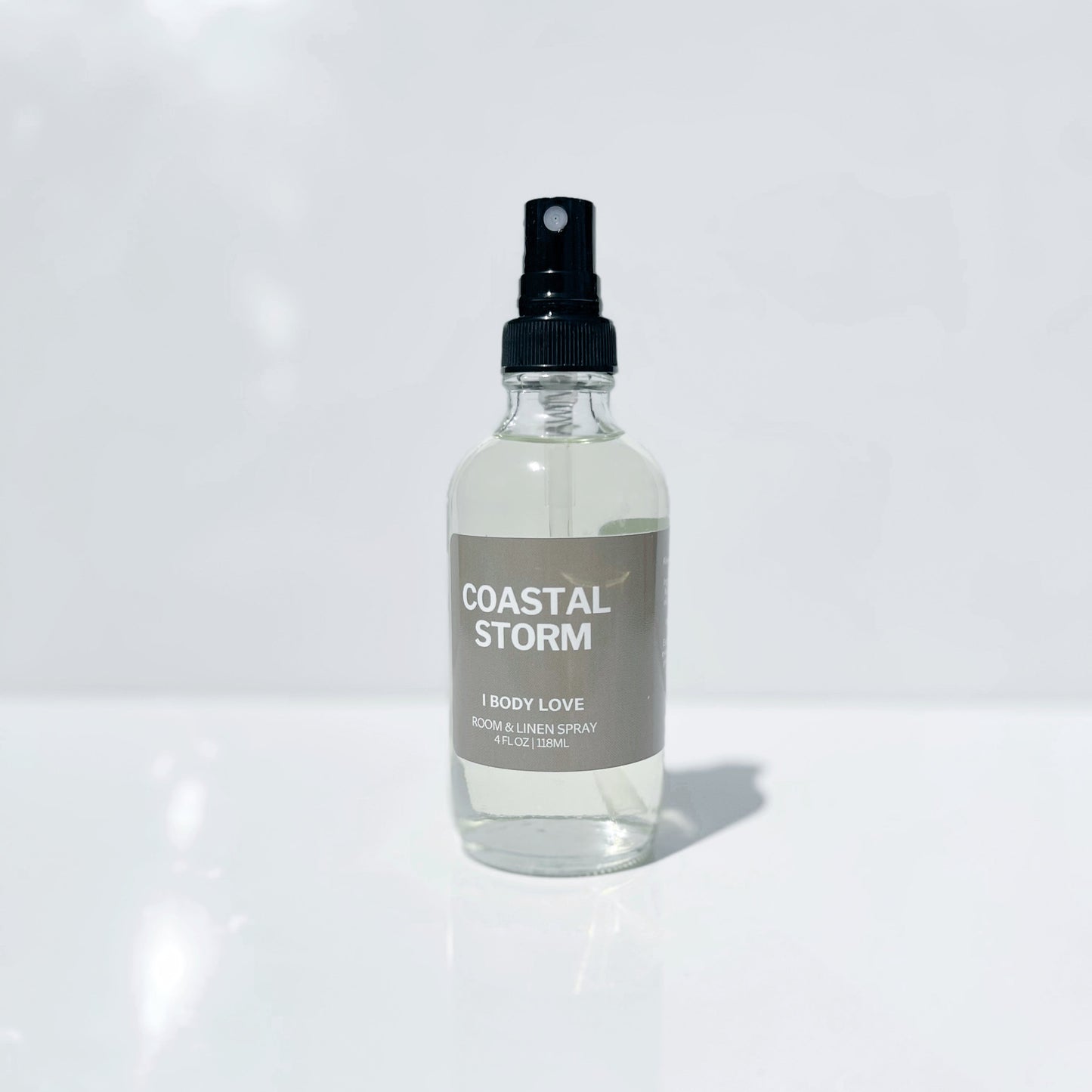 Room Spray Bottle of 'Coastal Storm' perfume on a white surface