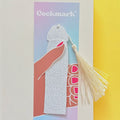 Decorative bookmark with tassel on a colorful background