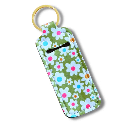 Floral patterned keychain with a green background