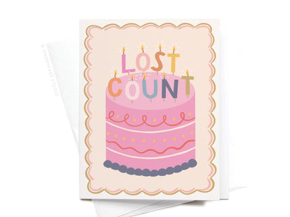 Greeting card with a pink cake illustration and 'Lost Count' text on a white background