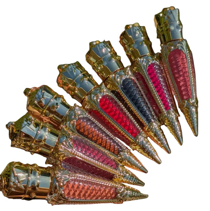 Decorative items resembling rocket ships with colorful designs on a white background