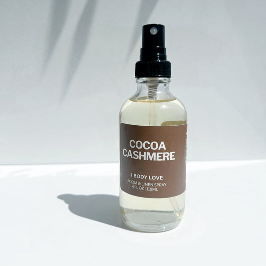 Bottle of 'Cocoa Cashmere' body spray on a white background