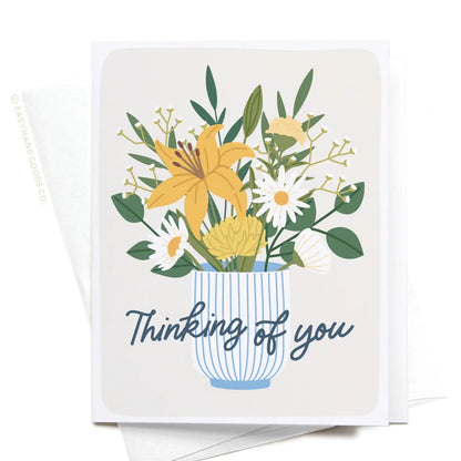 Greeting card with floral design and 'Thinking of you' text on a white background