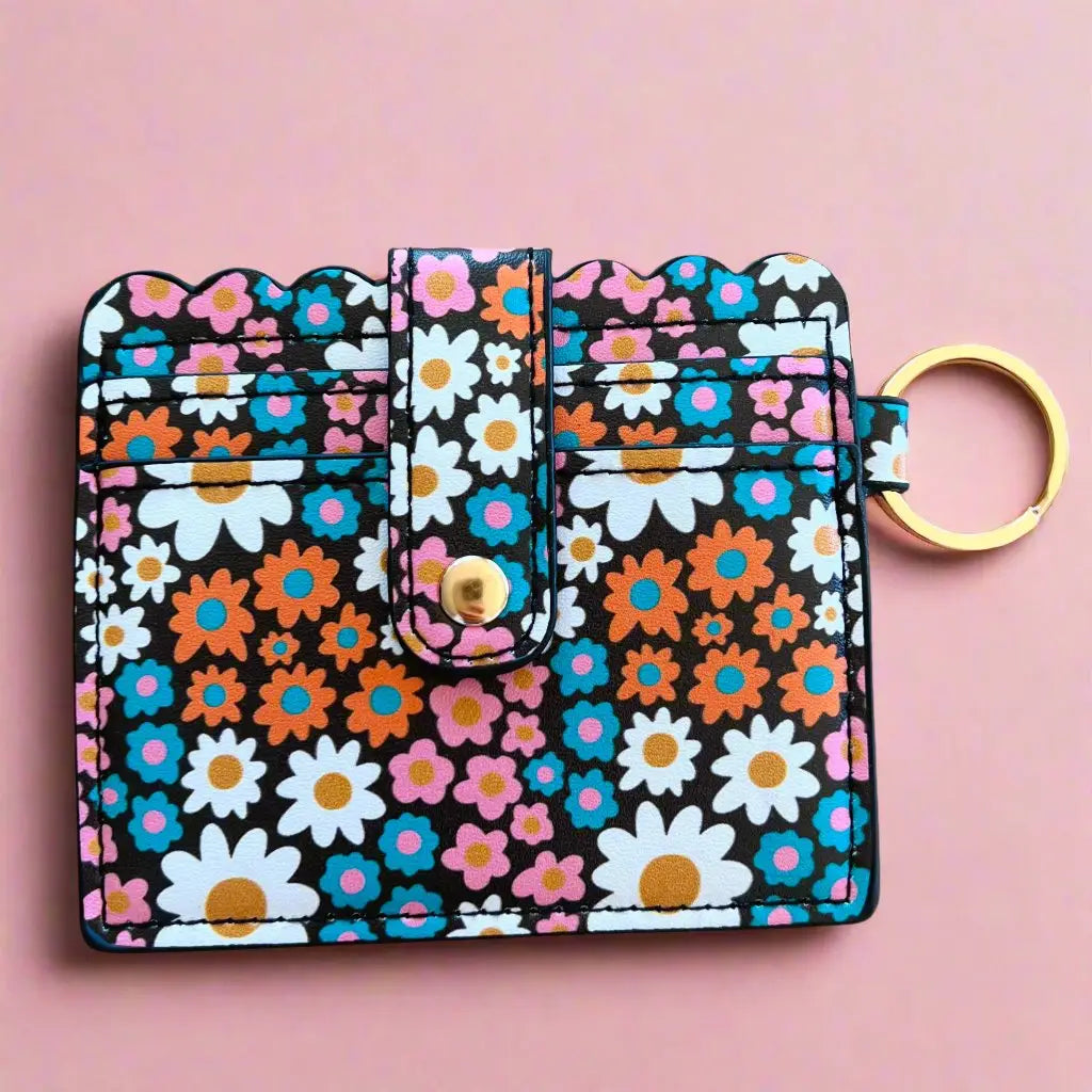 Floral patterned keychain organizer on a pink background
