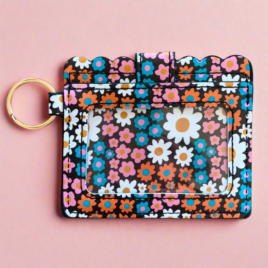 Floral patterned key fob on a pink background