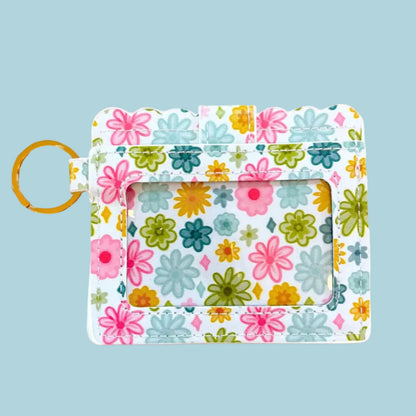 Floral-patterned keychain with a card holder on a white background