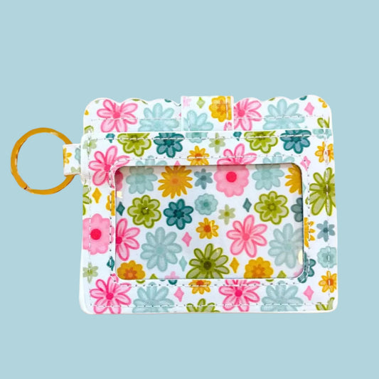 Floral-patterned keychain with a card holder on a white background